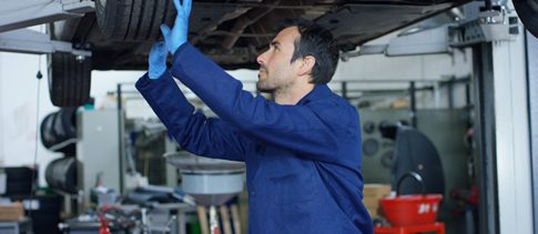 Technician carrying out an MOT test